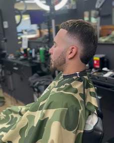 Client showing off a fresh mid fade haircut at Shaddai Barbershop in Dunnellon, FL