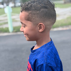 Boy with high fade and curly top by Shaddai Barbershop, Dunnellon FL